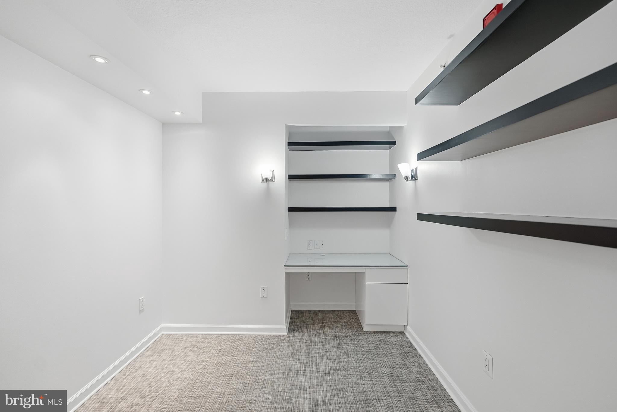 440 L Street Northwest, Unit 805 Washington, DC 20001 - Photo 33 of 38 a view of walk in closet with empty racks