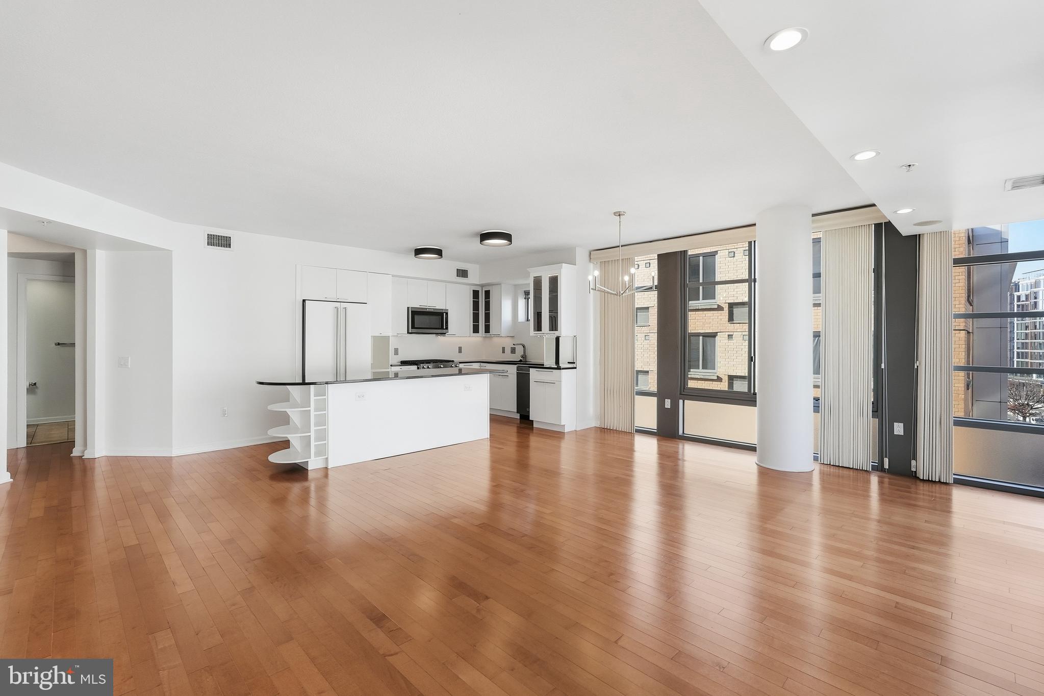 440 L Street Northwest, Unit 805 Washington, DC 20001 - Photo 7 of 38 a view of kitchen with furniture and wooden floor