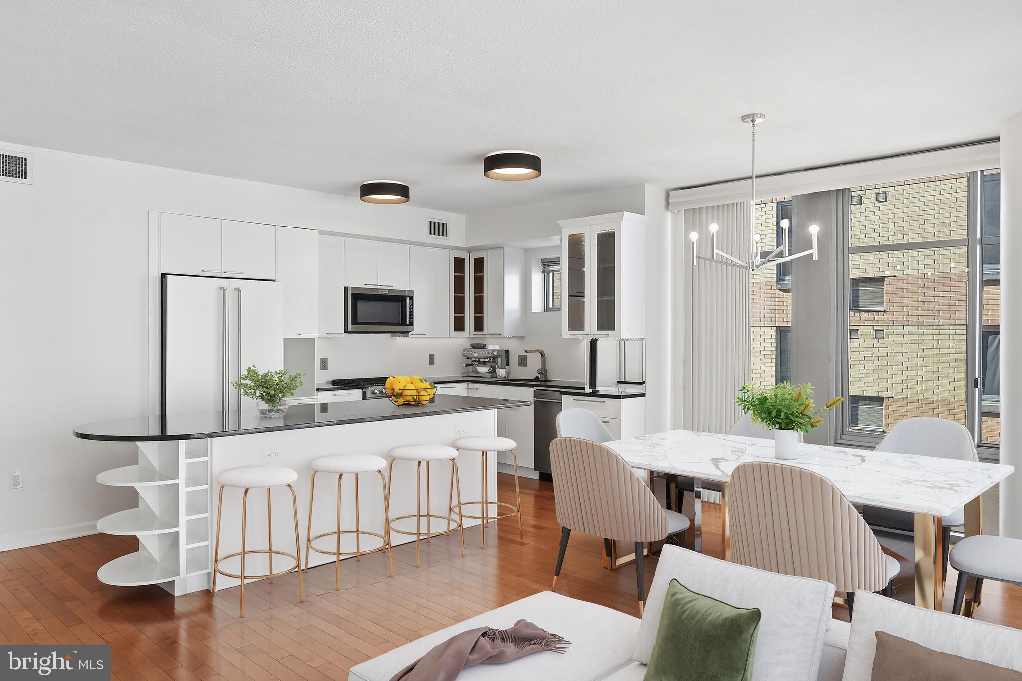 440 L Street Northwest, Unit 805 Washington, DC 20001 - Photo 8 of 38 a view of a dining room with furniture and wooden floor