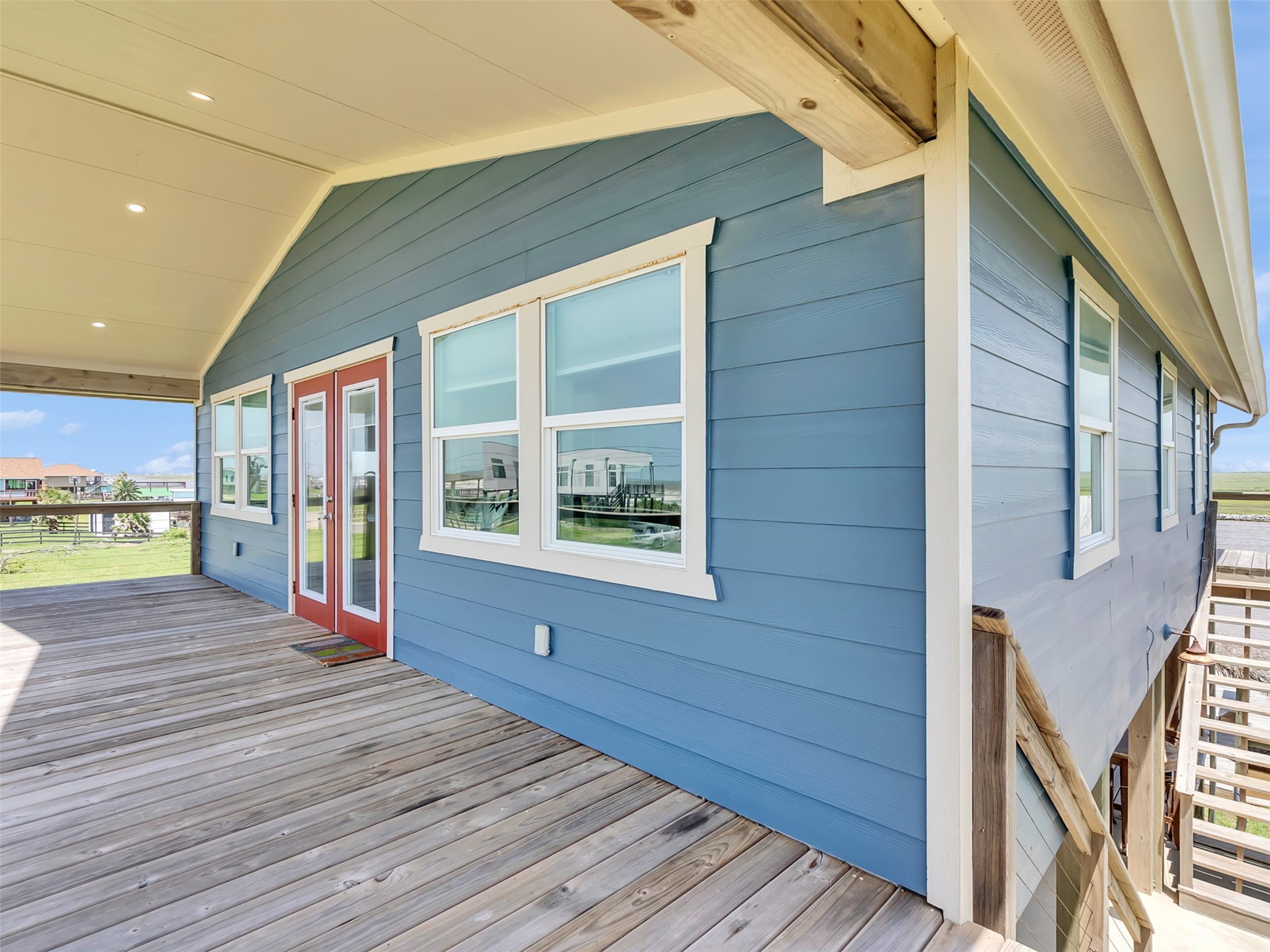 1453 County Road 230 Sargent, TX 77414 - Photo 7 of 38 Spacious wooden deck and a covered porch.