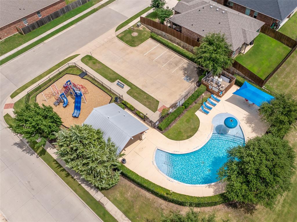 4016 Lazy River Ranch Road Fort Worth, TX 76262 - Photo 36 of 40 Community pool and playground at the end of the street