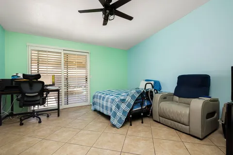 a bedroom with furniture and a window