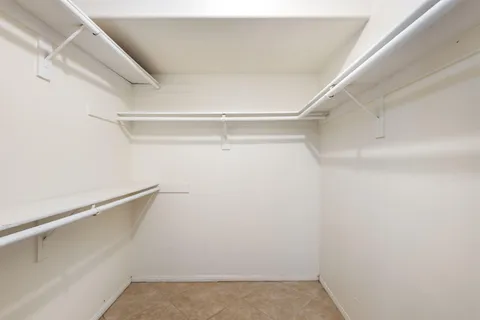 a view of an empty walk in closet