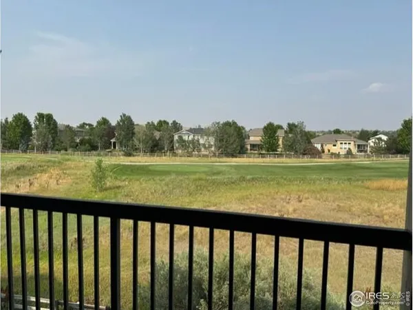 a view of lake and mountain from a balcony