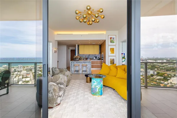 en view of living room with furniture and a large window