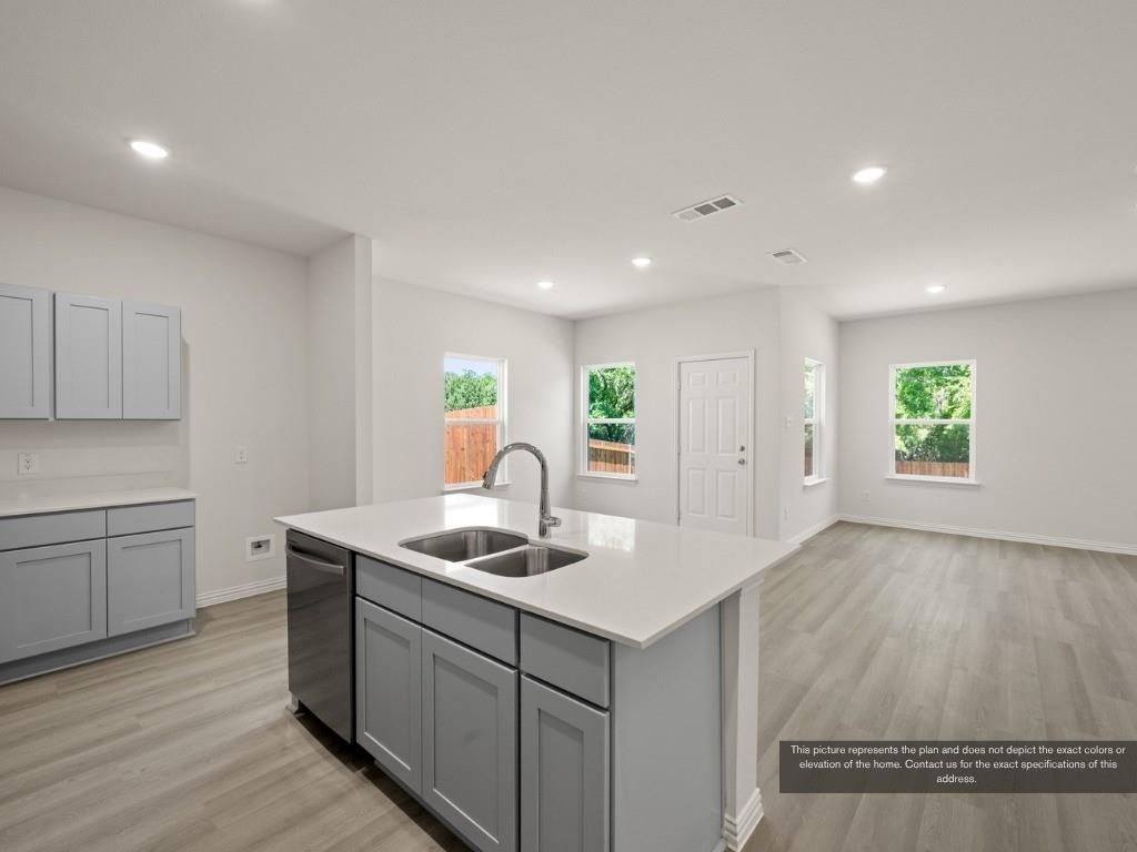 1805 Zelvia Lane Waco, TX 76708 - Photo 10 of 22 a kitchen that has a sink and a stove in it