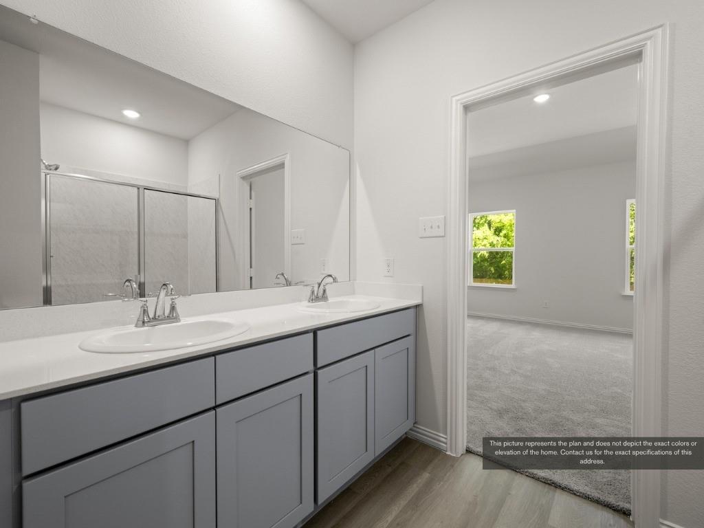 1805 Zelvia Lane Waco, TX 76708 - Photo 15 of 22 a bathroom with a sink and a mirror