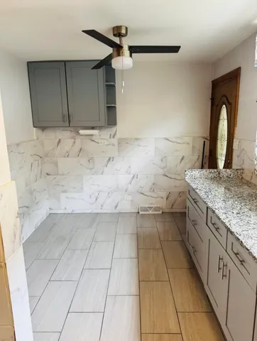 a kitchen with a sink and cabinets