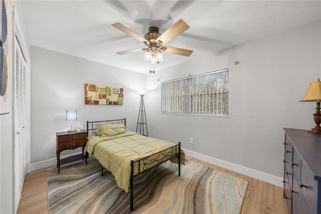 16675 Southwest 143rd Avenue Archer, FL 32618 - Photo 11 of 26 a bedroom with a bed and a table