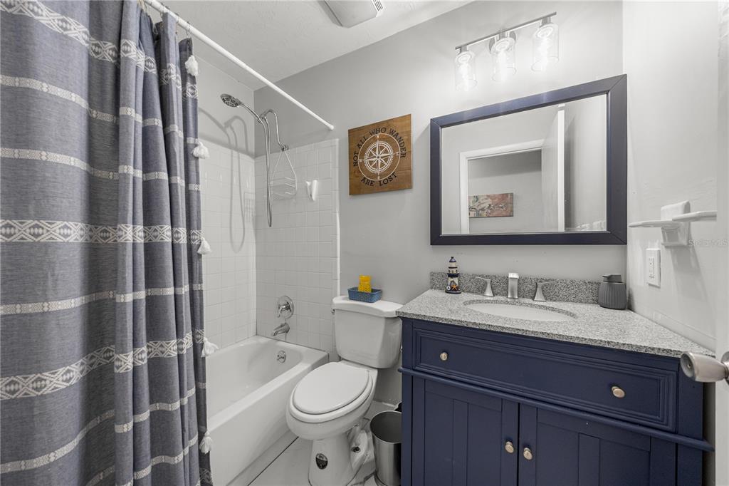 16675 Southwest 143rd Avenue Archer, FL 32618 - Photo 13 of 26 a bathroom with a toilet a sink and mirror