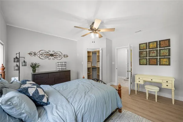 a bedroom with a bed and a table