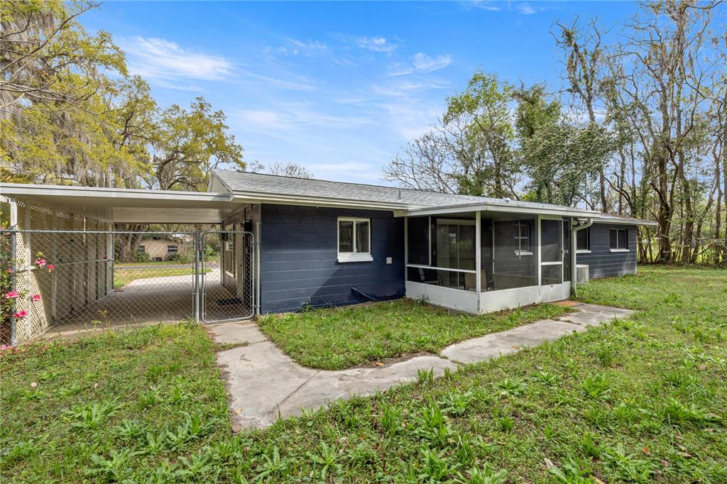16675 Southwest 143rd Avenue Archer, FL 32618 - Photo 20 of 26 a view of a house with a yard