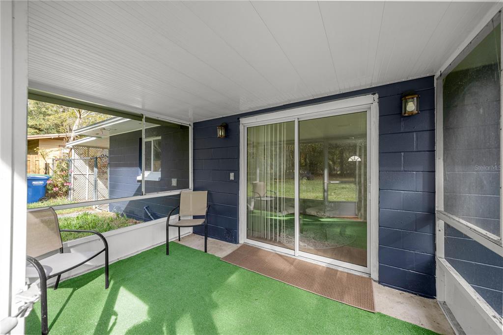 16675 Southwest 143rd Avenue Archer, FL 32618 - Photo 21 of 26 a view of an house with backyard porch and furniture