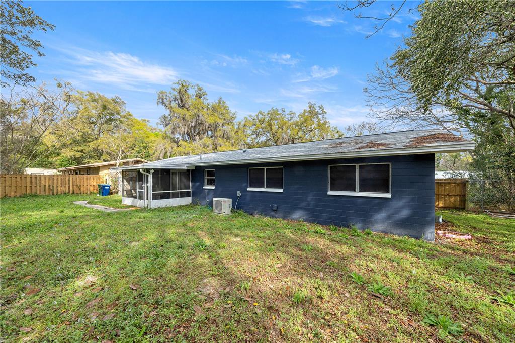 16675 Southwest 143rd Avenue Archer, FL 32618 - Photo 25 of 26 a front view of a house with garden