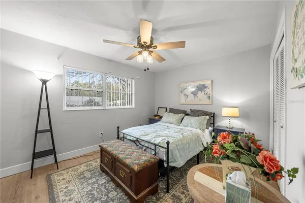 a bedroom with bed and a window