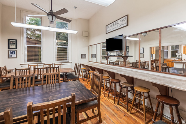 21 North Main Street Kingston, UT 84743 - Photo 61 of 107 Dining room featuring light wood-style flooring, a high ceiling, and a ceiling fan