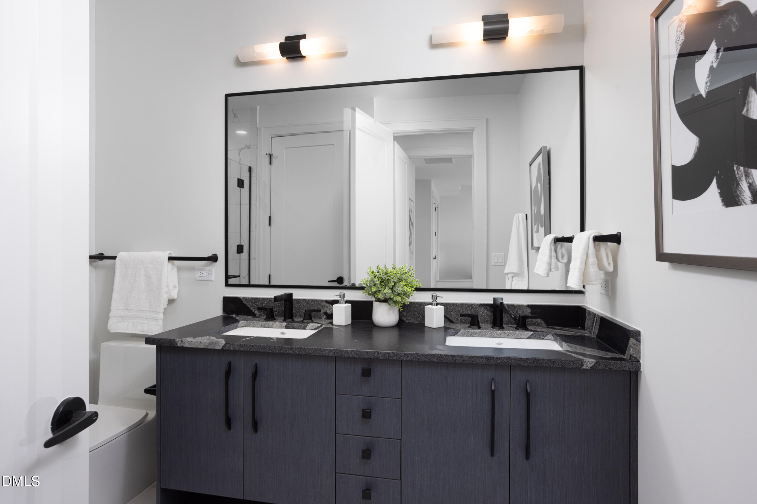 115 Morris Street, Unit 2010 Durham, NC 27701 - Photo 23 of 49 a bathroom with a sink and a mirror