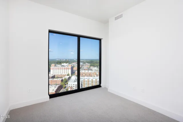 a bathroom with a double vanity sink mirror and shower