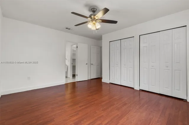 a bathroom with a toilet sink and shower