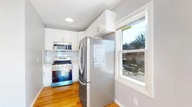 a bed room with a bed and cabinets