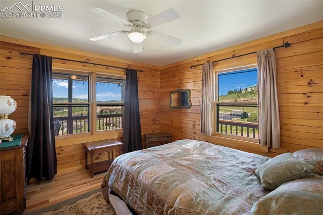 a bedroom with a large bed and a large window