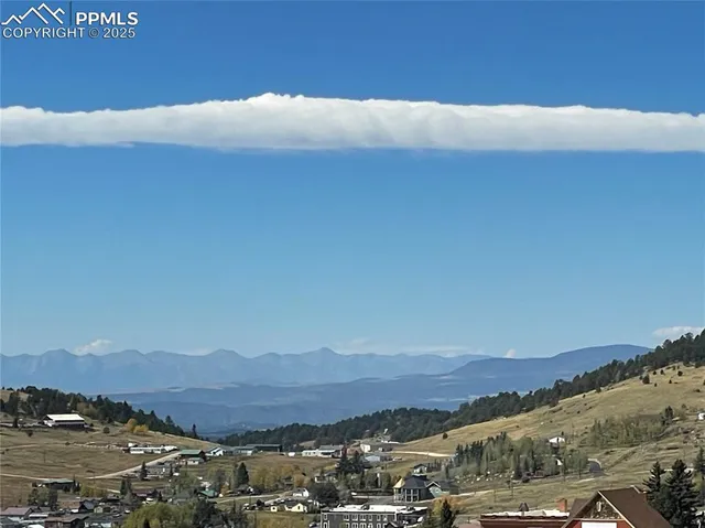 a view of city and mountains