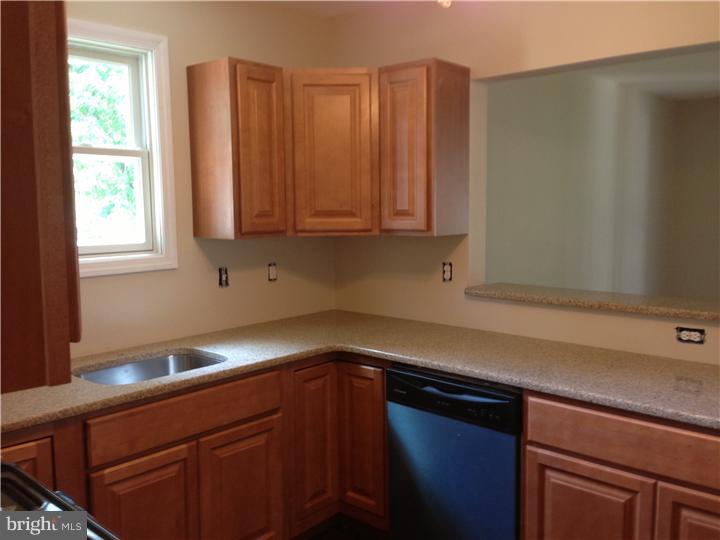 323 Ruth Avenue Maple Shade, NJ 08052 - Photo 8 of 21 a kitchen with appliances cabinets and a window