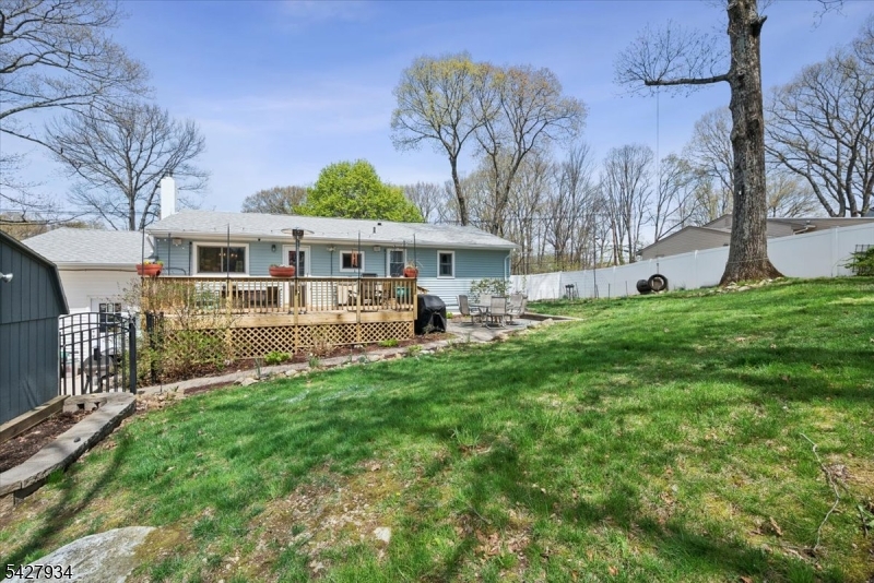 77 Brooklyn Road Stanhope, NJ 07874 - Photo 18 of 21 a front view of house with yard and trees in the background