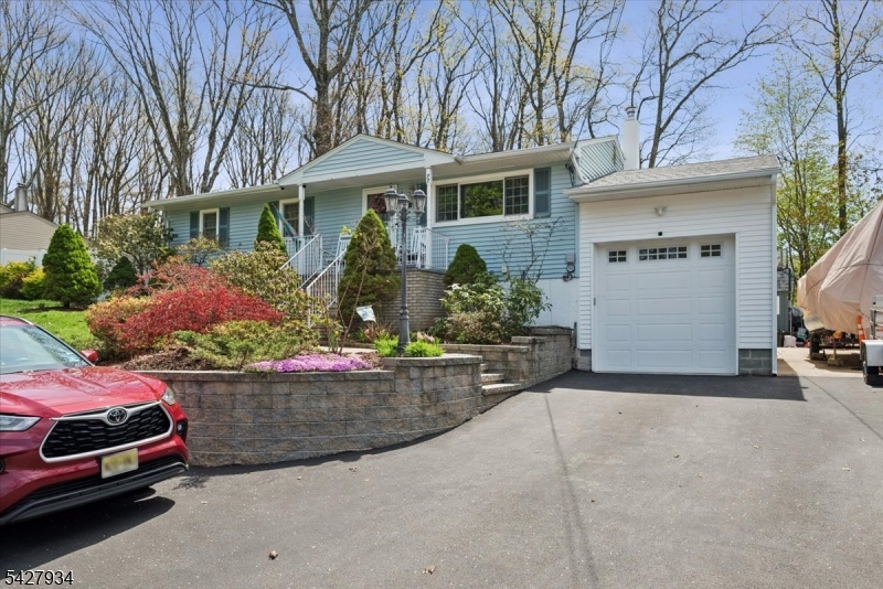 77 Brooklyn Road Stanhope, NJ 07874 - Photo 20 of 21 front view of a house with a yard