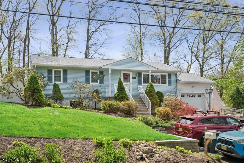 77 Brooklyn Road Stanhope, NJ 07874 - Photo 21 of 21 a front view of a house with garden