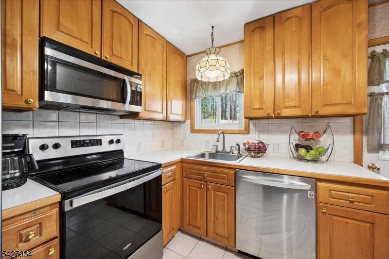 77 Brooklyn Road Stanhope, NJ 07874 - Photo 3 of 21 a kitchen with a sink stove and microwave