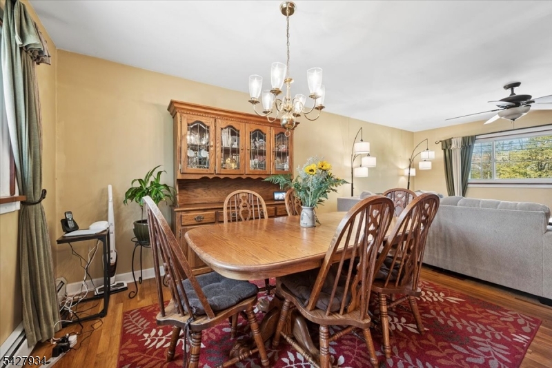 77 Brooklyn Road Stanhope, NJ 07874 - Photo 5 of 21 a view of a dining room with furniture and a chandelier