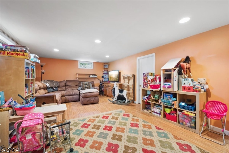 77 Brooklyn Road Stanhope, NJ 07874 - Photo 10 of 21 a bed room with a bed a couch and a closet