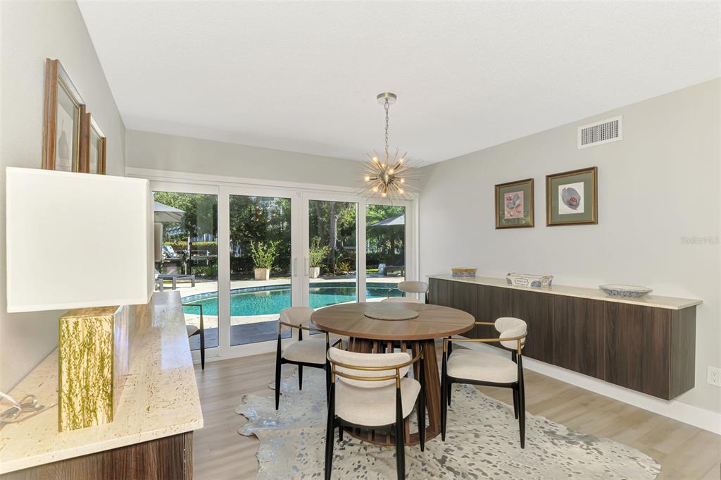 5303 Hidden Harbor Road Sarasota, FL 34242 - Photo 16 of 72 a view of a dining room with furniture window and outside view