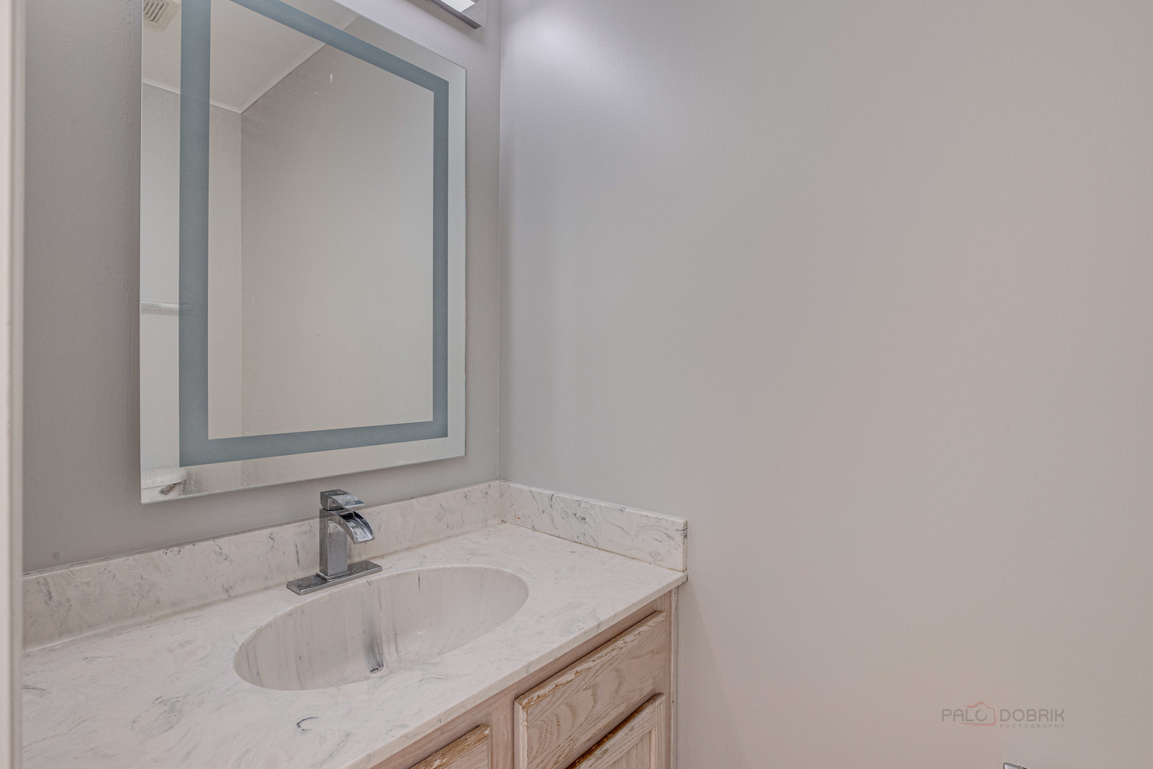 1655 Windward Court Naperville, IL 60563 - Photo 18 of 34 a bathroom with a sink and a mirror