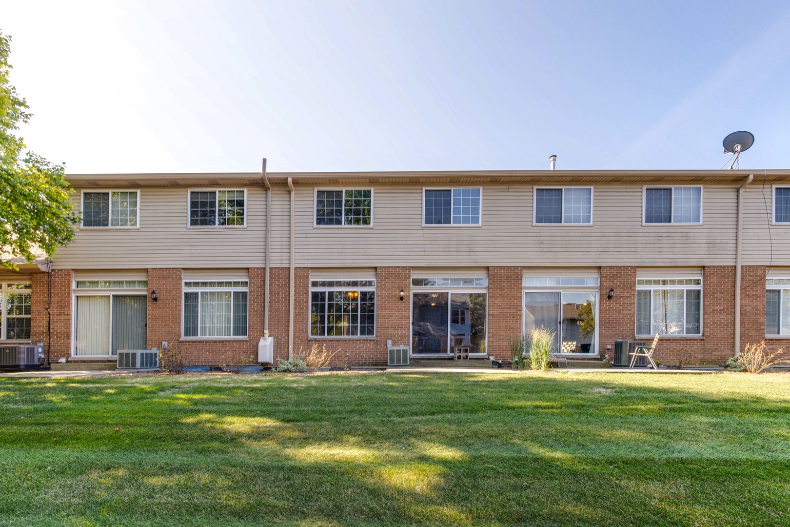 1655 Windward Court Naperville, IL 60563 - Photo 31 of 34 front view of a brick house with a yard