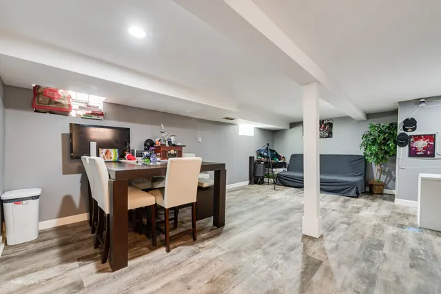 a view of a dining room with furniture and a livingroom with furniture