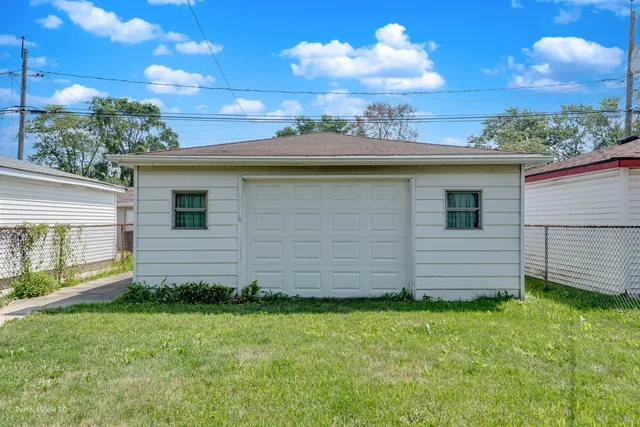 a view of a backyard with plants and a garden