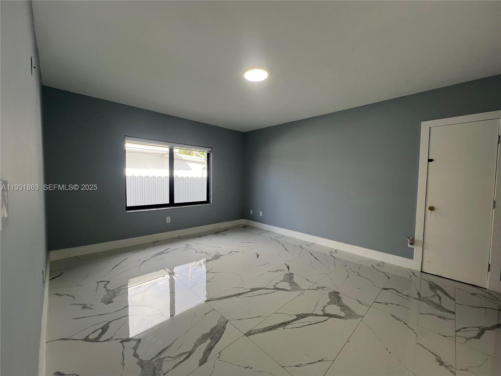 3297-3299 Southwest 26th Street Miami, FL 33133 - Photo 19 of 45 a view of empty room with windows