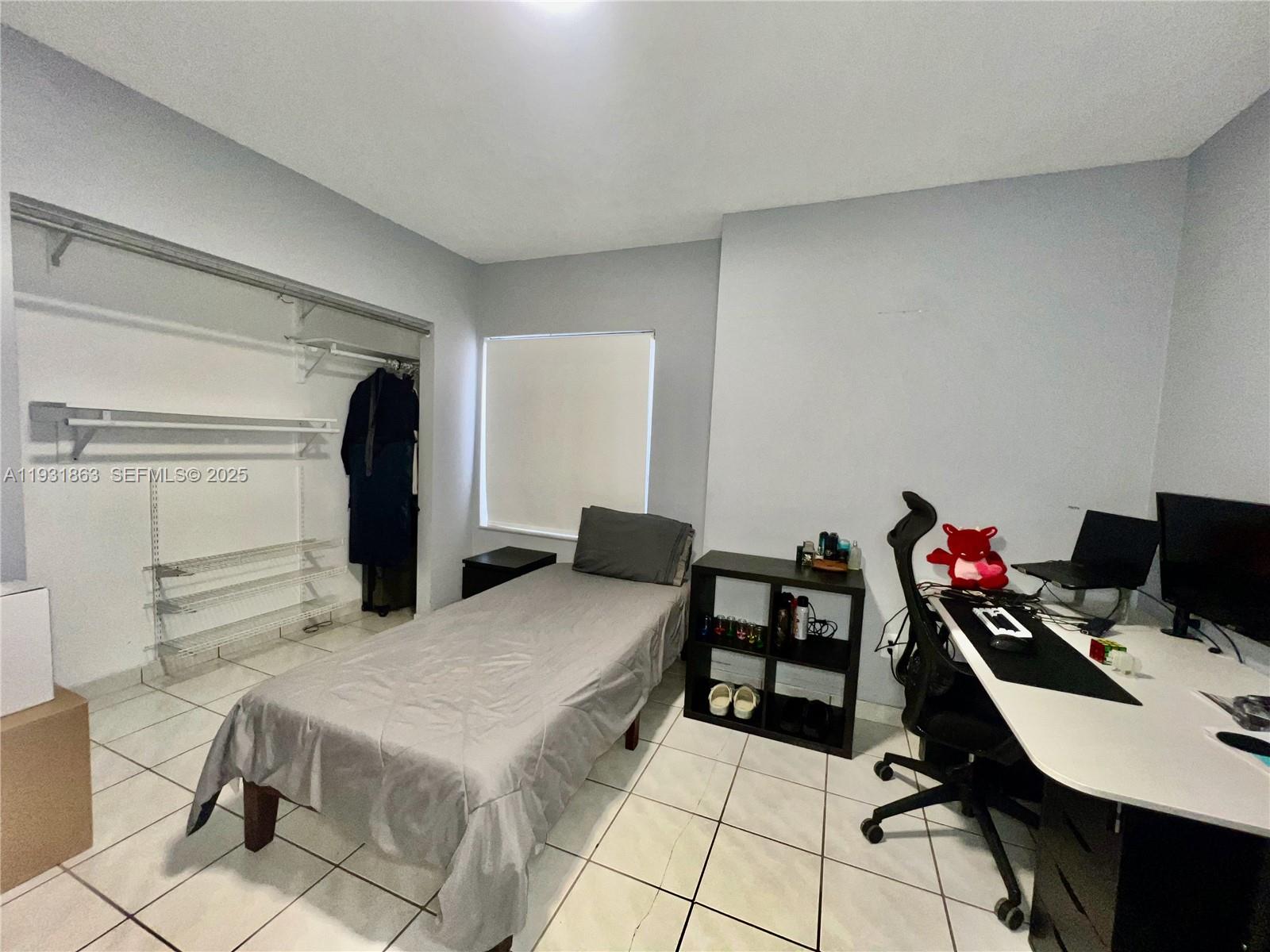 3297-3299 Southwest 26th Street Miami, FL 33133 - Photo 25 of 45 a bedroom with a bed and a table