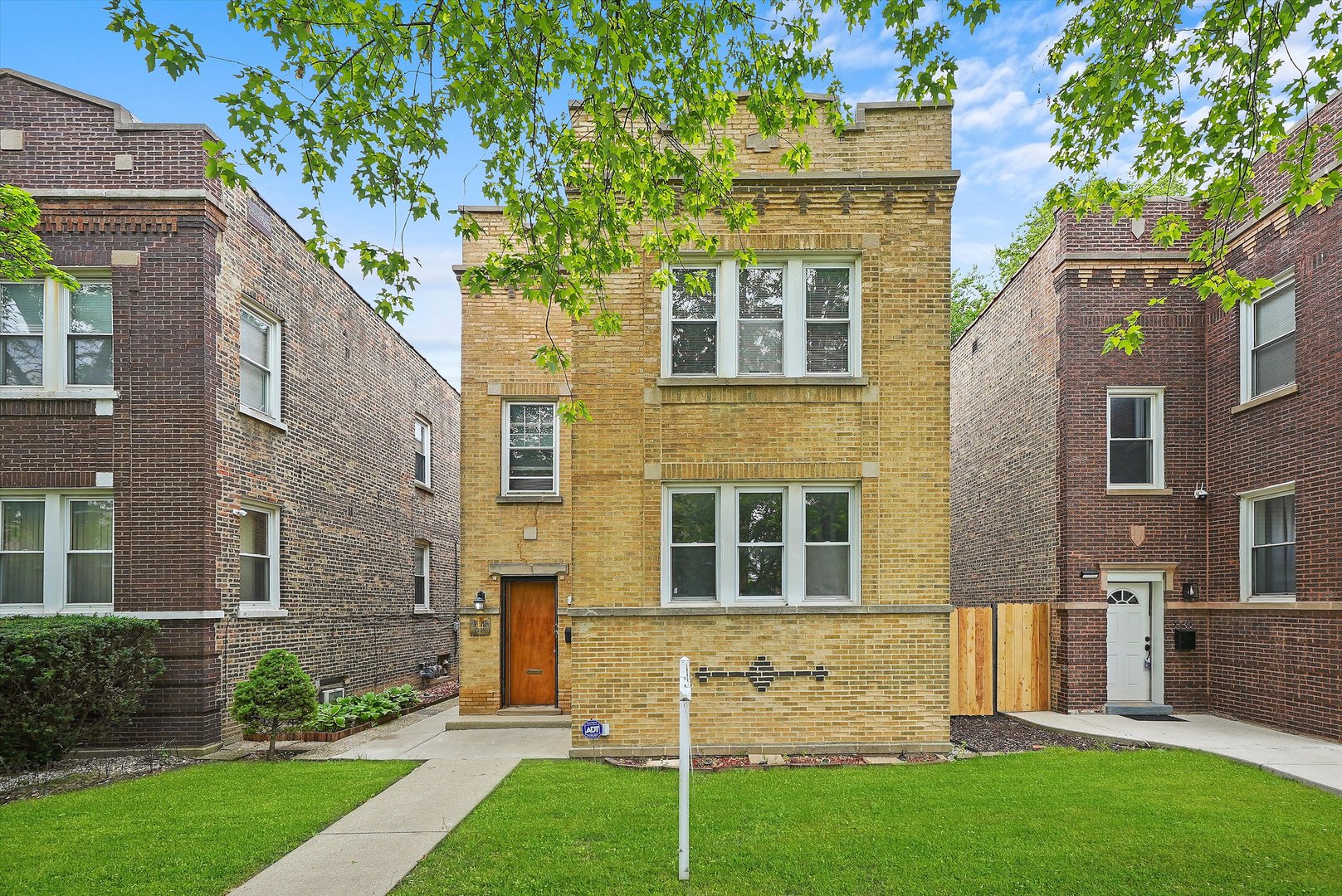 1738 North Menard Avenue Chicago, IL 60639 - Photo 1 of 9 a brick house with a large windows