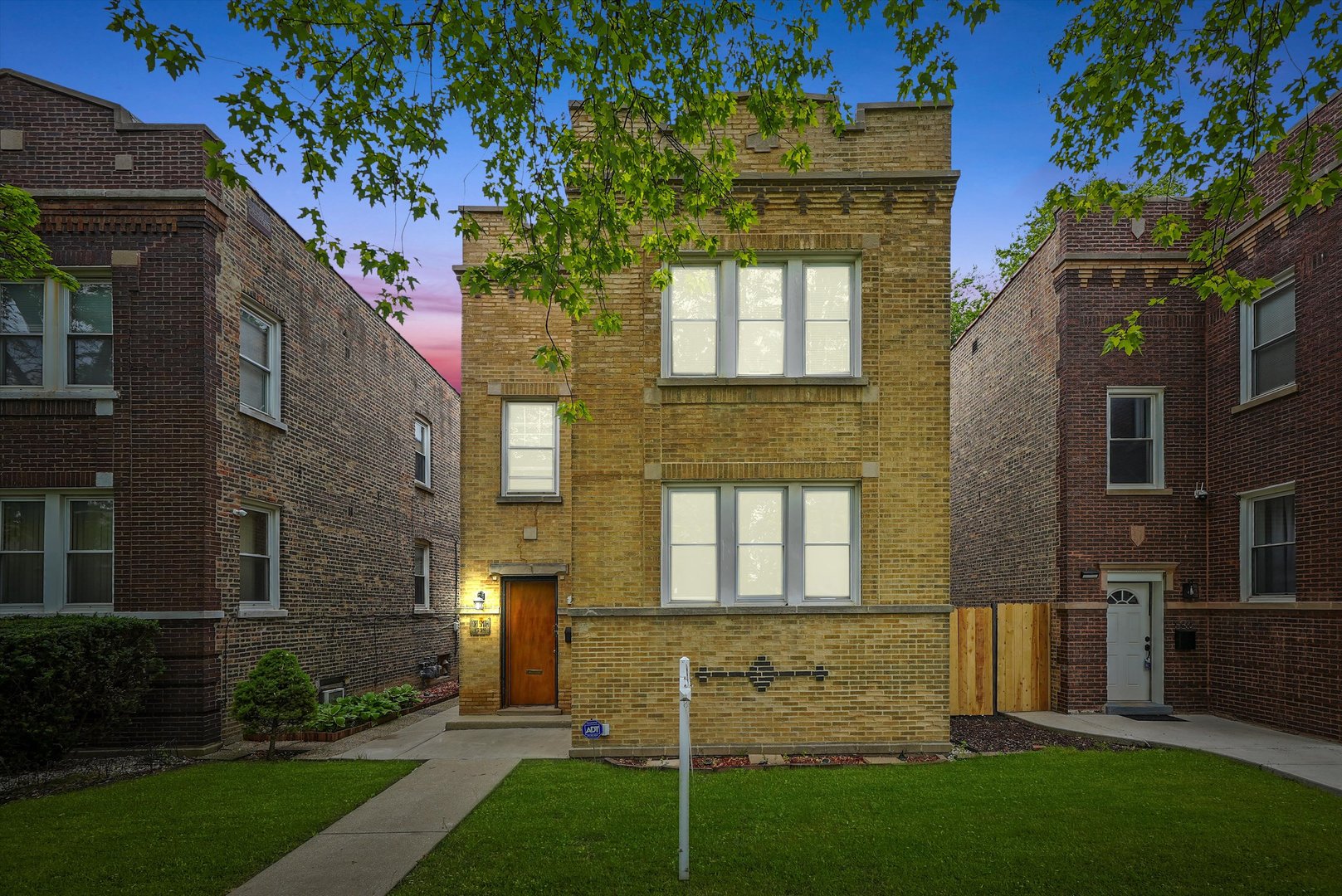 1738 North Menard Avenue Chicago, IL 60639 - Photo 3 of 9 a front view of a house with a garden