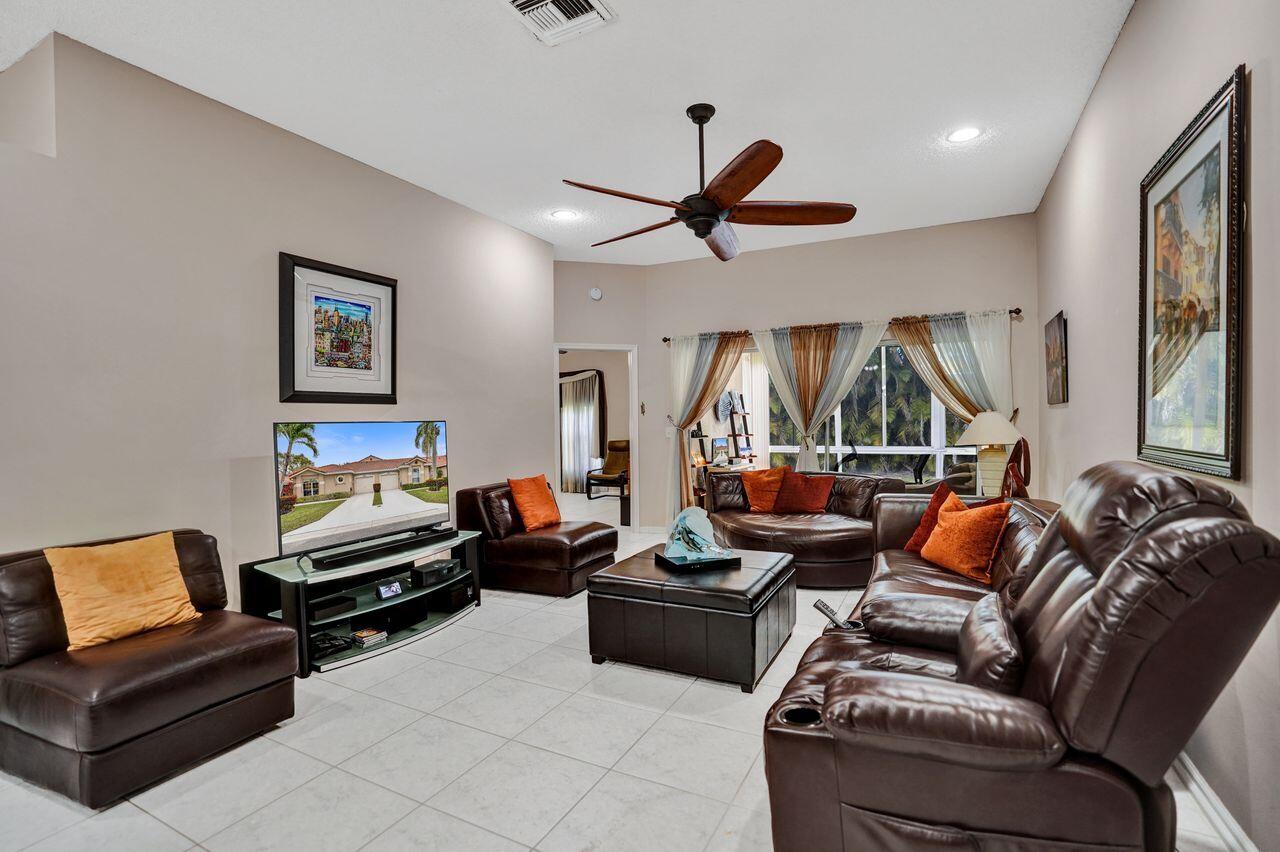 6251 Long Key Lane Boynton Beach, FL 33472 - Photo 12 of 41 a living room with furniture and a large window