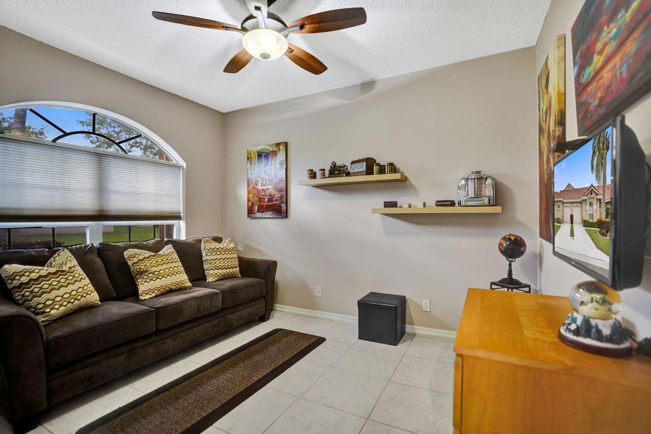 6251 Long Key Lane Boynton Beach, FL 33472 - Photo 18 of 41 a living room with furniture and a wooden floor