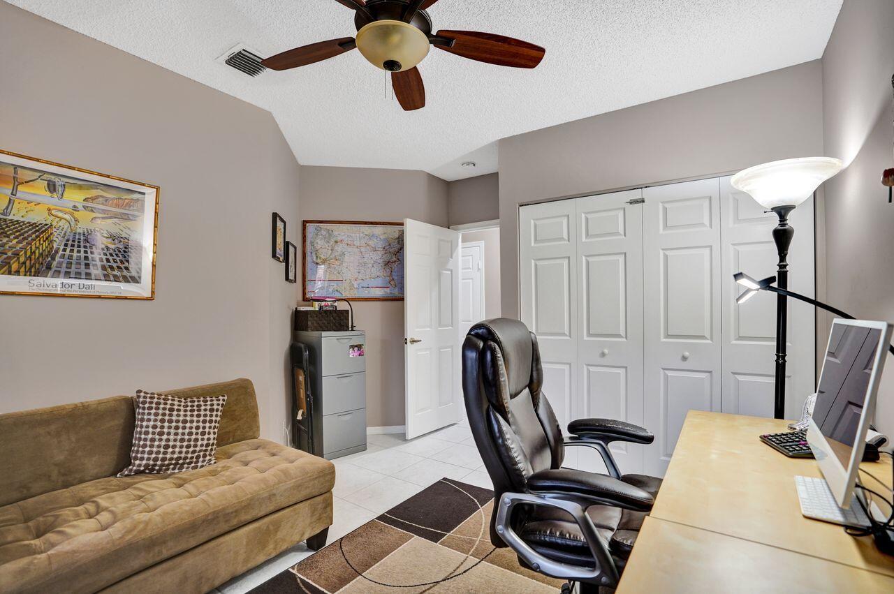 6251 Long Key Lane Boynton Beach, FL 33472 - Photo 22 of 41 a living room with furniture and a flat screen tv