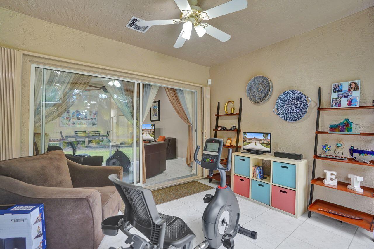 6251 Long Key Lane Boynton Beach, FL 33472 - Photo 24 of 41 a living room with furniture and a large window