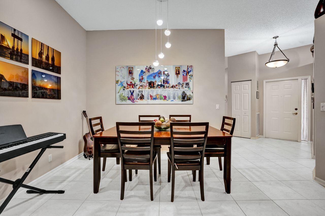 6251 Long Key Lane Boynton Beach, FL 33472 - Photo 9 of 41 a view of a dining room with furniture