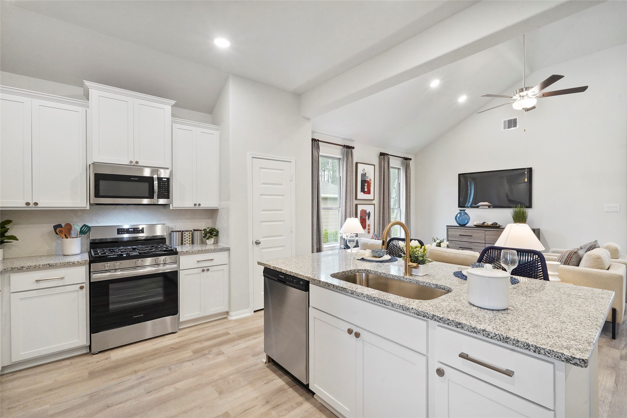604 Danielle Dayton, TX 77535 - Photo 14 of 34 a kitchen with sink a stove and cabinets
