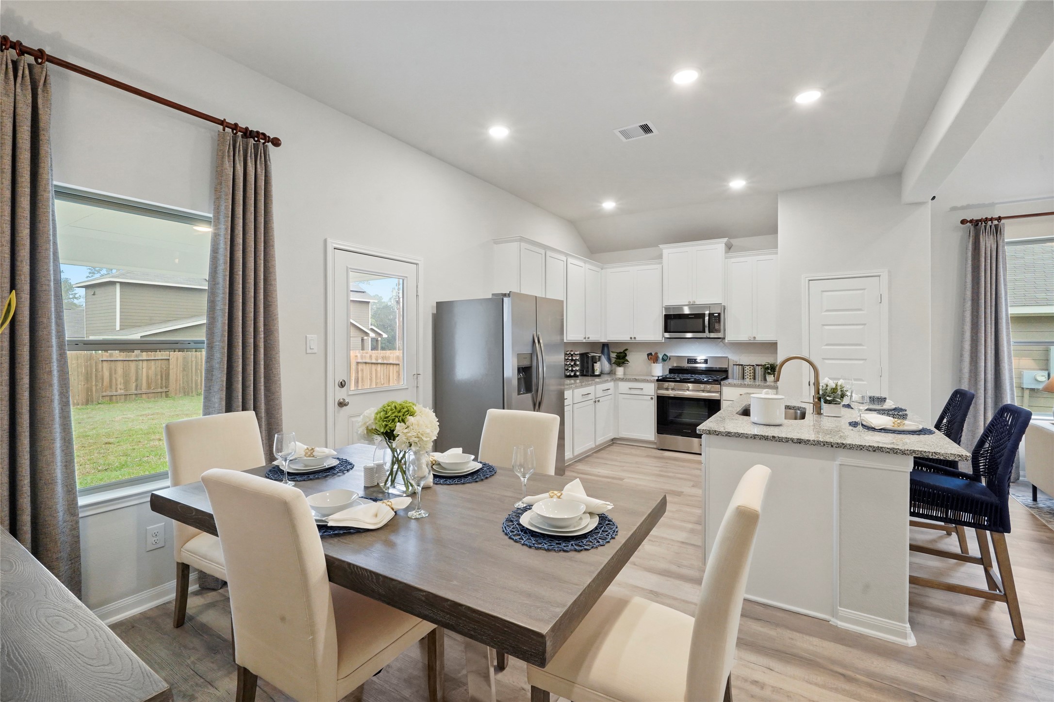 604 Danielle Dayton, TX 77535 - Photo 16 of 34 a open dining room with stainless steel appliances kitchen island granite countertop furniture and a kitchen view