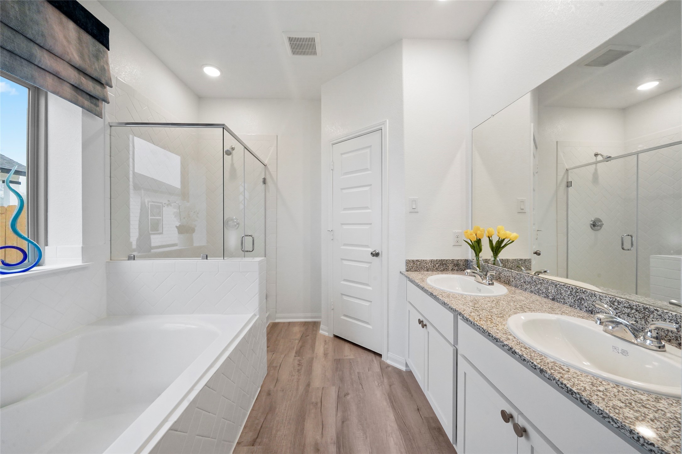 604 Danielle Dayton, TX 77535 - Photo 21 of 34 a bathroom with a granite countertop tub sink and mirror